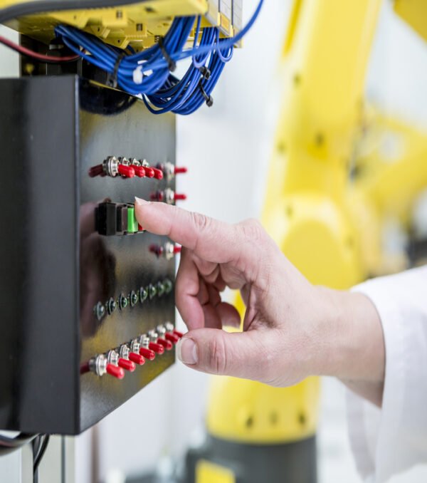 close-up-of-woman-switching-on-switch-in-factory-2024-09-19-03-26-49-utc (1)